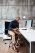 © BONNINSTUDIO/Stocksy - Serious man reading documents in office