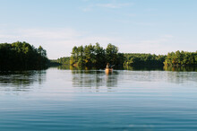 Person In An Orange Kayak On A Lake