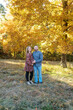 © Serena Burroughs/Stocksy - man and pregnant woman hugging outdoors in fall
