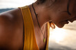© Luis Herrera/Stocksy - closeup of unrecognizable woman chest