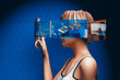 © Marcos Osorio/Stocksy - Woman interacting with Metaverse screens
