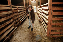 The Farmer Cleans The Stall On The Farm