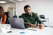 © Pedro Merino/Stocksy - Businessman working with laptop in a coworking