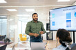 © Pedro Merino/Stocksy - Businessman making a presentation at a meeting in the office