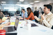 © Pedro Merino/Stocksy - Office colleagues working in a coworking space with laptops
