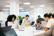 © Pedro Merino/Stocksy - Focused office coworkers using laptops in a coworking space