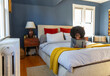 © Raymond Forbes LLC/Stocksy - Black Girl house on video chat with ipad tablet computer in bedroom