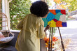 © Raymond Forbes LLC/Stocksy - African American Lifestyle Girl artist Painting in neighborhood