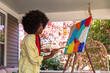 © Raymond Forbes LLC/Stocksy - African American Lifestyle Girl artist colorful Painting