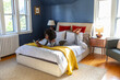 © Raymond Forbes LLC/Stocksy - black Girl at house drawing  with ipad tablet computer in bedroom