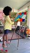 © Raymond Forbes LLC/Stocksy - African American Lifestyle Girl artist Painting easel in home studio