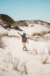 © Guille Faingold/Stocksy - Child walk on sand.
