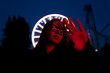 © Nikita Sursin/Stocksy - young stylish woman posing in illuminated amusement park