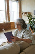 © Tatiana Timofeeva/Stocksy - Senior Woman Reading A Book