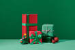 © Marc Tran/Stocksy - Christmas presents on green background