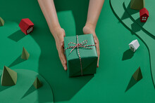 Woman Holding In Hands Christmas Present With Ribbon. Xmas Concept