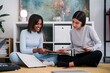 © Studio Marmellata/Stocksy - Joyful multiracial women choosing LP record at home