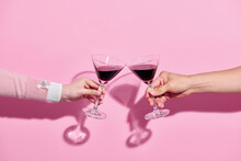 Two Glasses Of Wine In The Hands Of A Man And A Woman