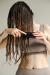 © Asya Molochkova/Stocksy - Combing wet hair. Beauty hair everyday routine
