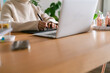 © ByLorena/Stocksy - Woman using graphic tablet by laptop at office