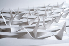 Triangular Shapes Cut From Plain Paper Resembling Bird Wings