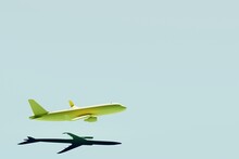 Airplane Isolated On Blue Background. 3D Rendering.