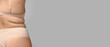 © Pixel-Shot - Overweight woman on grey background with space for text. Weight loss concept