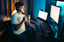 Gamer Playing Multi-screen Video Games Online