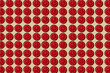 © Juan Moyano/Stocksy - mosaic of red clocks set at different hours