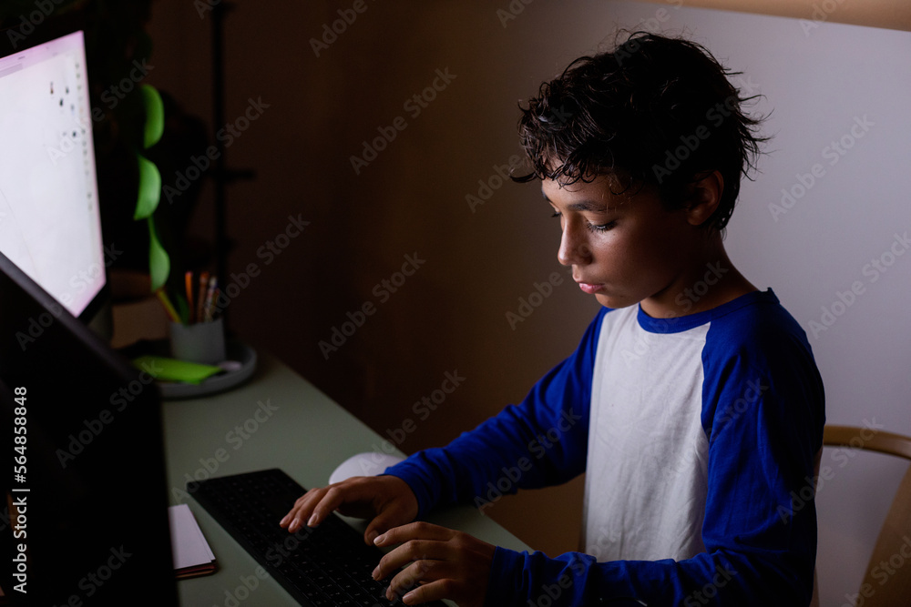 teen boy using computer Stock Photo | Adobe Stock