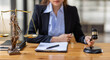 © David - Business Asian woman in suit and Lawyer working on a documents at workplace office. Judge gavel with Justice lawyers,  Legal law, advice  and justice concept