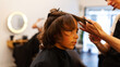 © Valentina Barreto/Stocksy - Boy at hairdresser getting an haircut