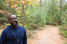 Caribbean Man Smiling On Trail At Bradbury Mountain State Park