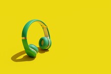 3D Rendering Blue Headphones On A Yellow Background 