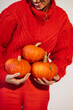 © Sergey Filimonov/Stocksy - Happy smiling woman with pumpkins