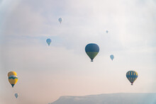 Hot Air Balloons In Cloudy Sky