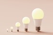 © Davide Illini/Stocksy - Many light bulbs on a pastel background. Concept 3d illustration.
