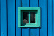 © Alba Vitta/Stocksy - Small window on cabin