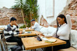 © Jimena Roquero/Stocksy - Group of people in modern coworking space