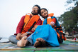 © Dream Lover/Stocksy - Young Couple Enjoying Travel Sitting On A Boat Over River Ganga,India