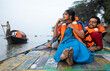 © Dream Lover/Stocksy - Young Couple Enjoying Travel Sitting On A Boat Over River Ganga,India