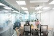 © Santi Nuñez/Stocksy - Businesspeople Working in Bright Workspace Office