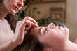 © Ibai Acevedo/Stocksy - Acupuncture therapy on woman forehead