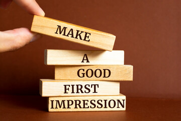 Poster - Wooden blocks with words 'Make a Good First Impression'.