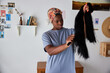 © Javier Díez/Stocksy - Woman brushing fake hair