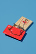 © Javier Díez/Stocksy - Credit card stuck in mousetrap