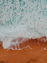 Aerial View Of Waves In A Beach