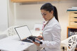 © Javier Pardina/Stocksy - Female nutritionist working