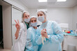 © AD Astra Team/Stocksy - The surgeon and the interns are standing in the operating room