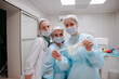 © AD Astra Team/Stocksy - The surgeon and the interns are standing in the operating room